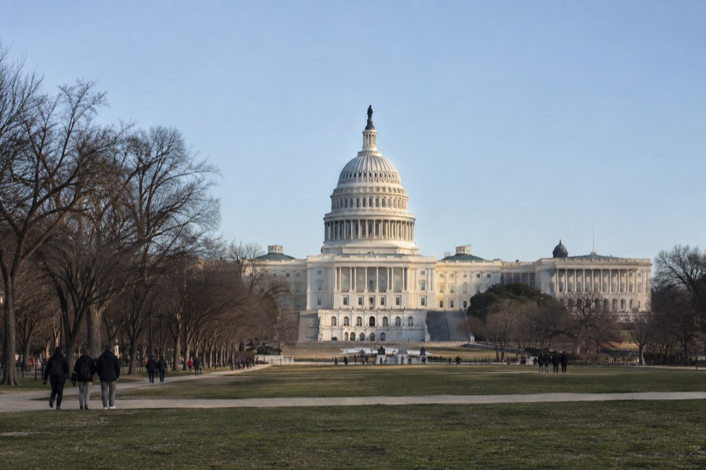 The United States Capitol building seen from the National Mall on a clear morning