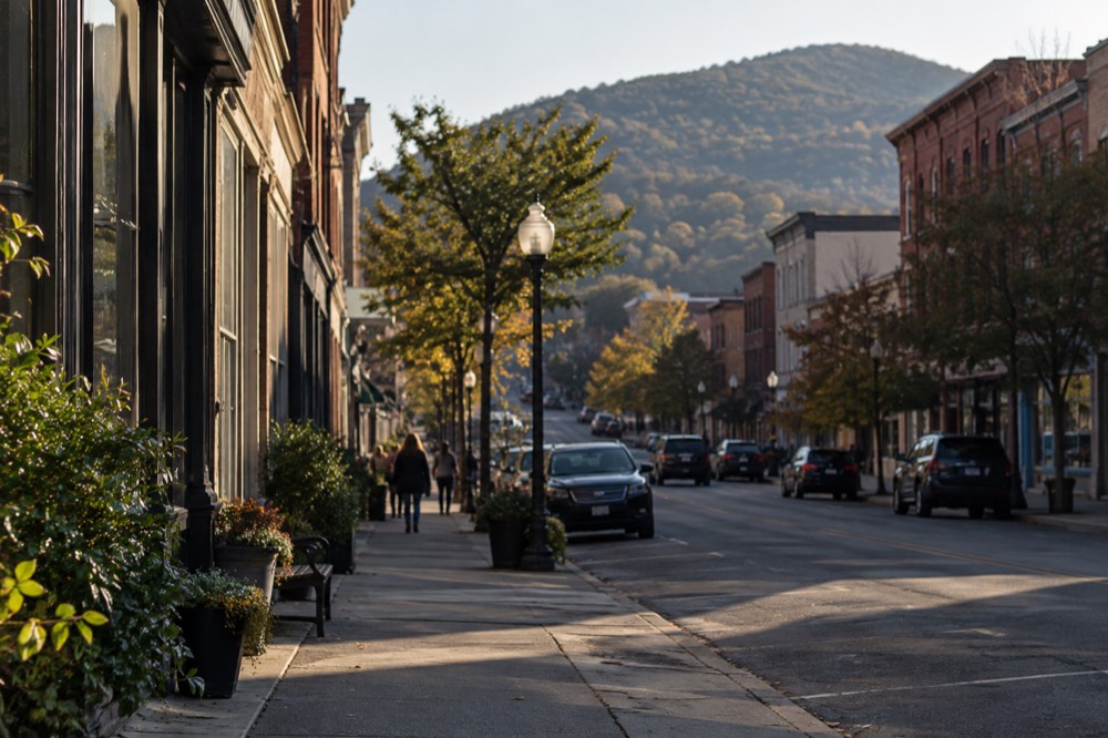 Main Street in Beacon, New York, with small shops and hills rising behind the town