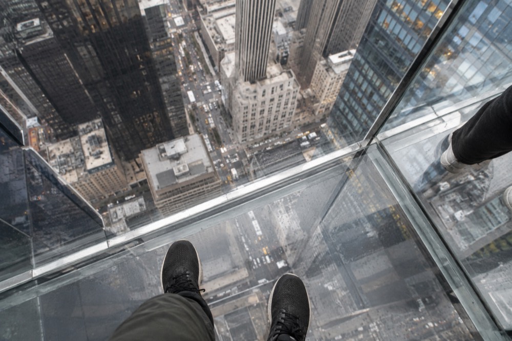 The glass floor on a cantilevered observation deck with streets far below