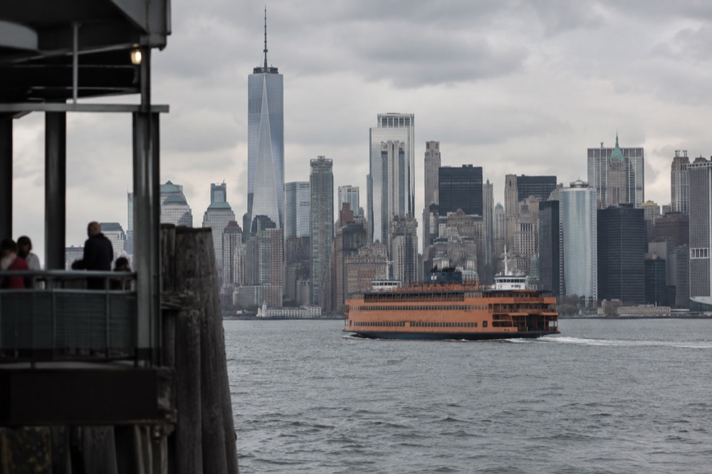 The Staten Island Ferry crossing the harbor with the Lower Manhattan skyline behind it