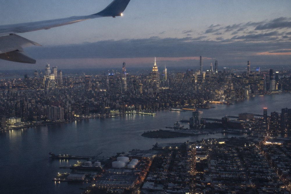 The Manhattan skyline seen from the window of an incoming flight on approach to JFK