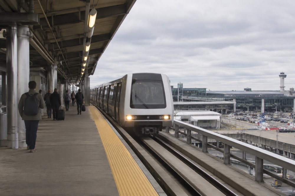 An AirTrain monorail arriving at a JFK airport terminal station