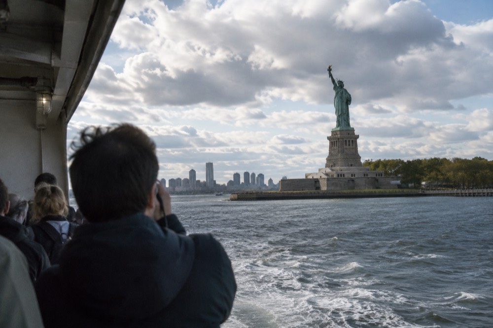 The Statue of Liberty seen from a ferry crossing New York Harbor