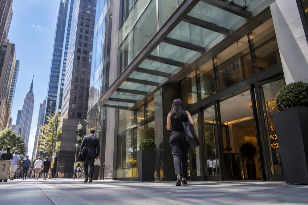 A modern Midtown hotel entrance with a wide level doorway and glass frontage