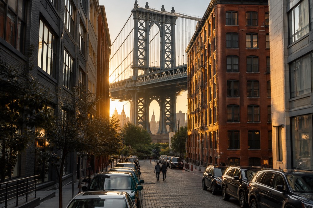 The Manhattan Bridge framed by buildings on Washington Street in Dumbo, Brooklyn