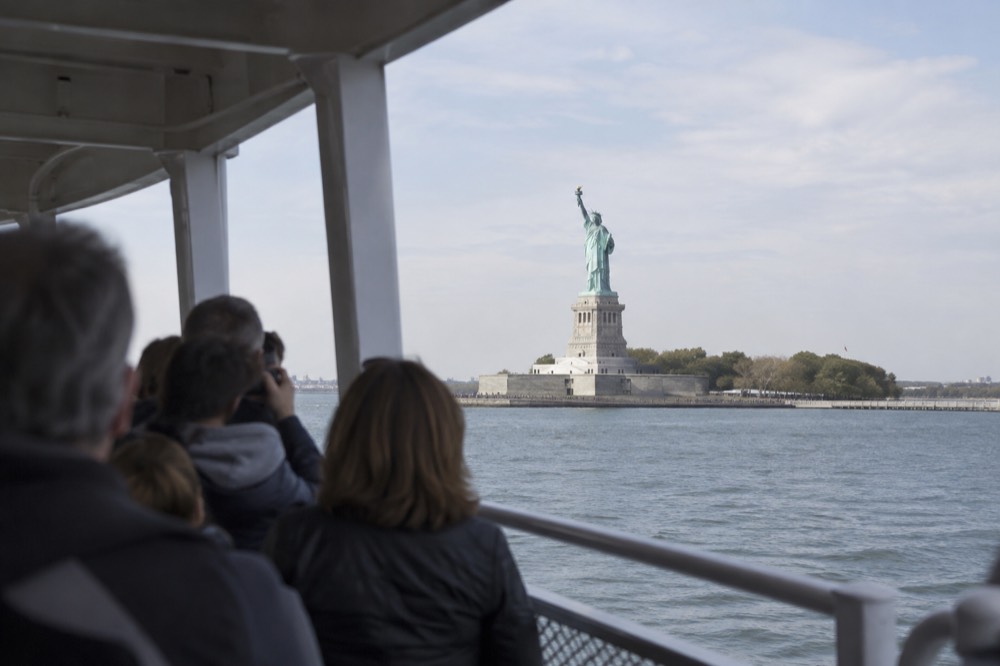 The Statue of Liberty seen from a ferry deck on a clear morning