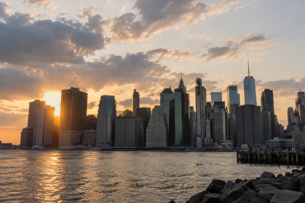 The Manhattan skyline at golden hour seen from across the East River