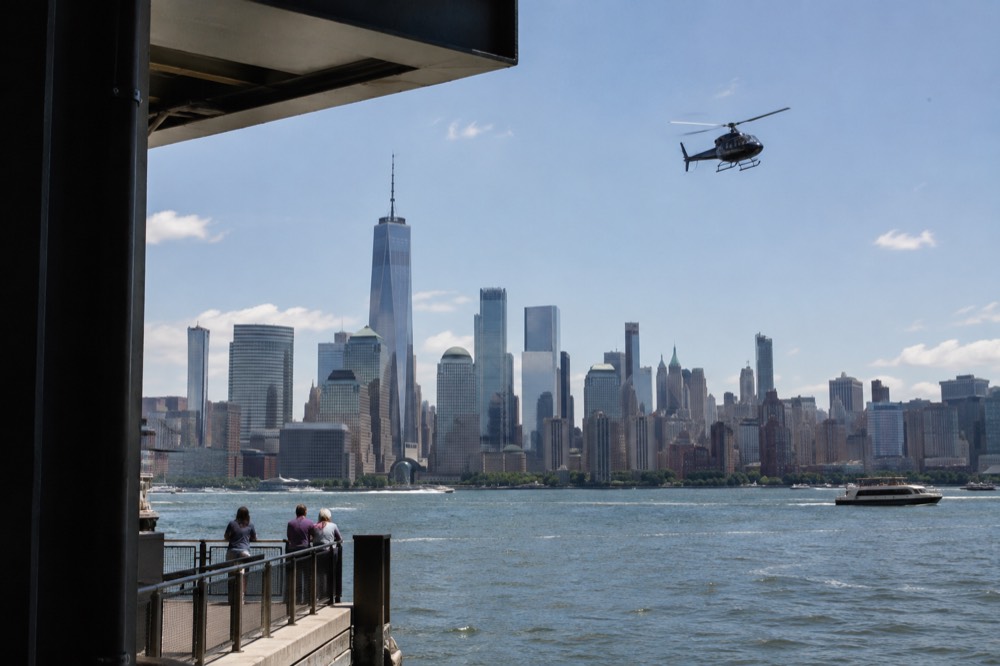 Helicopter flying over the Manhattan skyline